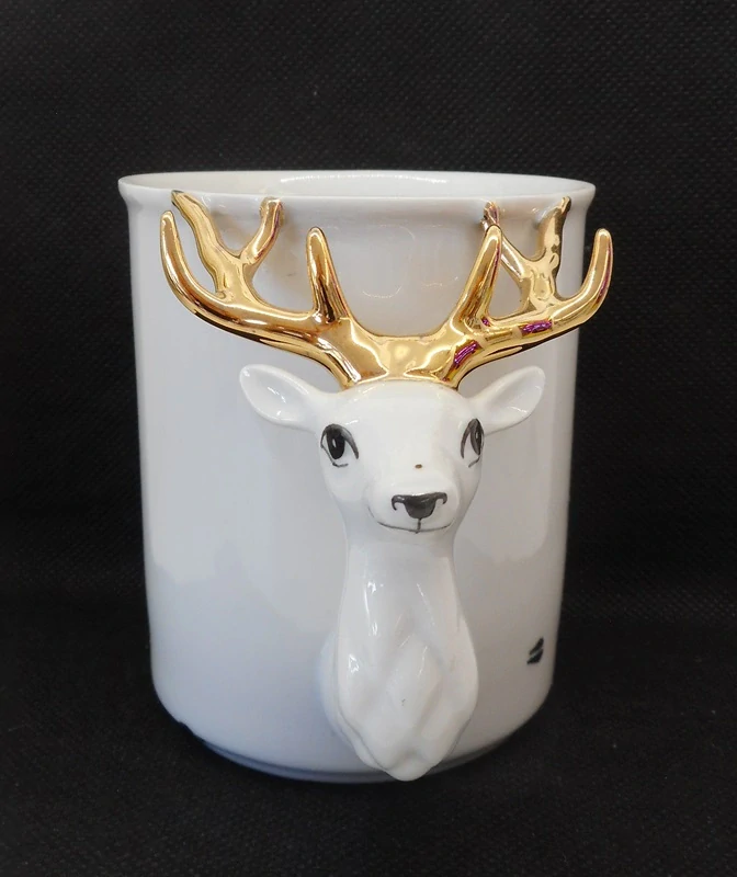 GOLDFINGER porcelán: Hrnek - Jelen