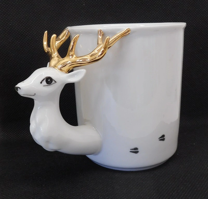GOLDFINGER porcelán: Hrnek - Jelen